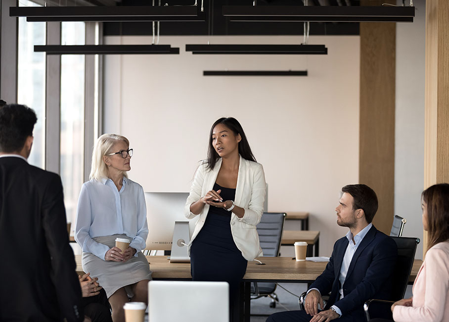 woman-leading-meeting woman-leading-meeting